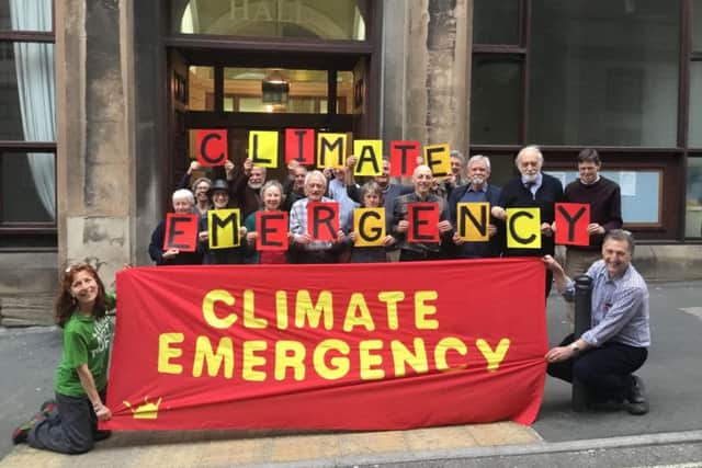 Climate Emergency campaigners press for action to reduce carbon emissions.