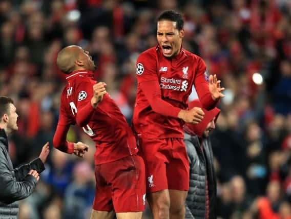 Liverpool's Fabinho (left) and Virgil van Dijk celebrate after the UEFA Champions League Semi Final, second leg match at Anfield.