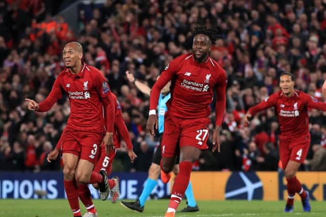 Liverpool's Divock Origi celebrates scoring his side's fourth goal.