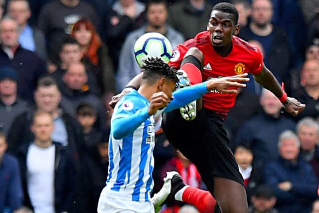 Huddersfield Town's Juninho Bacuna even got a boot in the face from Manchester United's Paul Pogba (Picture: Anthony Devlin/PA Wire)
