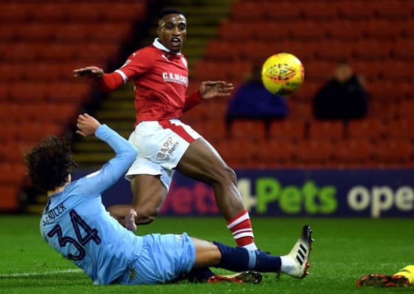 Barnsley's Victor Adeboyejo beats Manchester City's Philippe Sandler to open the scoring. in the Checkatrade Trophy earlier this season. (Picture: Jonathan Gawthorpe)