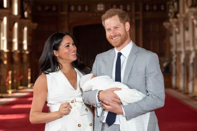 The Duke and Duchess of Sussex with their baby son, who was born on Monday morning, during a photocall in St George's Hall at Windsor Castle in Berkshire. PRESS ASSOCIATION Photo. Picture date: Wednesday May 8, 2019. Photo: Dominic Lipinski/PA Wire