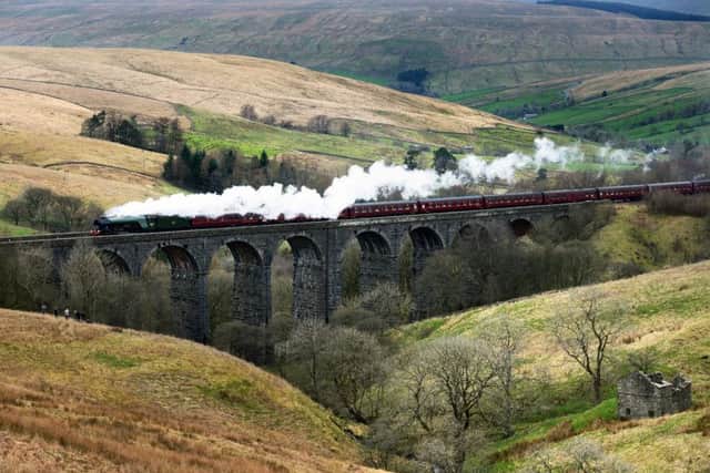 The Flying Scotsman crossing the Dent Head Viaduct on its  return journey from Carlisle to Oxenhope to celebrate the re-opening of the Settle Carlisle Railway line.  31 March 2017.