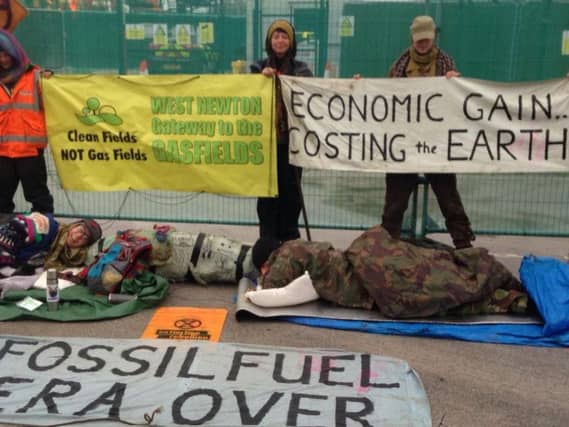 Protestors have spent the past 12 hours locked into devices at the West Newton wellsite
