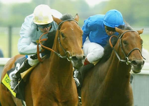Kieren Fallon and North Light (left) hold on to deny Frankie Dettori's mount Rule Of Law at the end of the 2004 Dante Stakes at York.