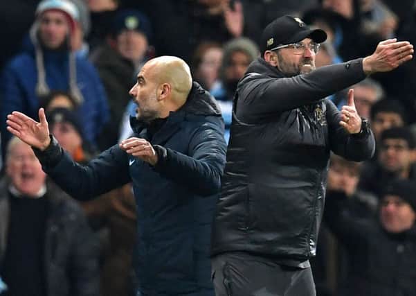 Liverpool's German manager Jurgen Klopp (R) and Manchester City's Spanish manager Pep Guardiola (L) gesture on the touchline during the English Premier League football match between Manchester City and Liverpool at the Etihad Stadium in Manchester, north west England, on January 3, 2019 (Picture: PAUL ELLIS/AFP/Getty Images)