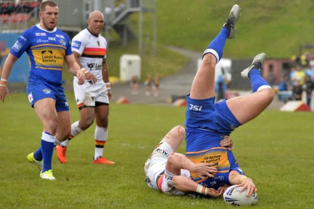 Up and over: Callum McLelland score the Rhinos' second try against Bradford Bulls (Picture: Bruce Rollinson)