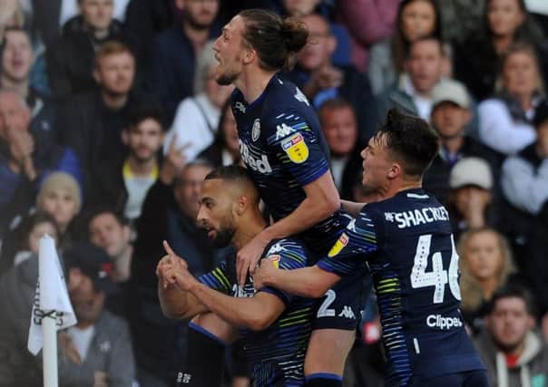 Kemar Roofe is congratulated by team-mates Jamie Shackleton and Luke Ayling after giving Leeds United the advantage in Saturdays play-off semi-final second leg. (Picture: Tony Johnson)