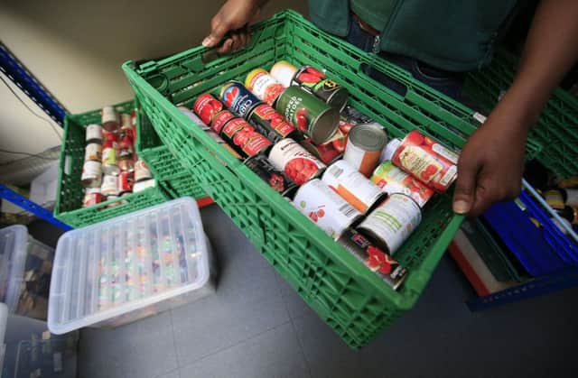 As food banks give out more supplies, action to cut food waste is also being discussed.