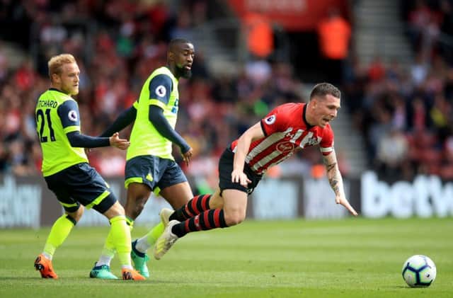 Southampton's Pierre-Emile Hojbjerg is fouled by Huddersfield Town's goalscorer Alex Pritchard, left, during the 1-1 draw at St Mary's Stadium (Picture: Adam Davy/PA Wire).