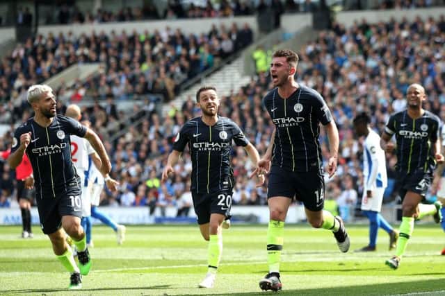 Manchester City's Aymeric Laporte (centre right) celebrates scoring his side's second goal against Brighton at the AMEX Stadium. Picture: Nick Potts/PA
