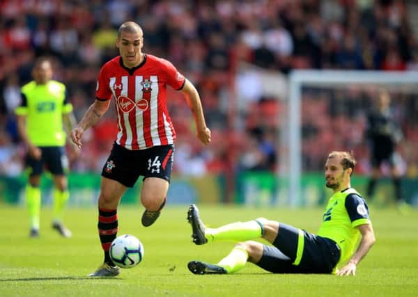 Southampton's Oriol Romeu gets away from Huddersfield Town's Jon Gorenic Stankovic at St Mary's Stadium. Picture: Adam Davy/PA