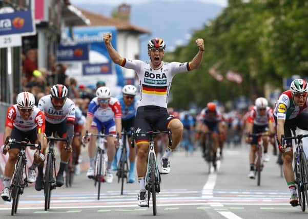 Team Bora rider Germany's Pascal Ackermann jubilates as he finishes first the second stage of the 2019 Giro d'Italia, the cycling Tour of Italy, on May 12, 2019 in Fucecchio. Picture: Luk Benies/AFP/Getty Images