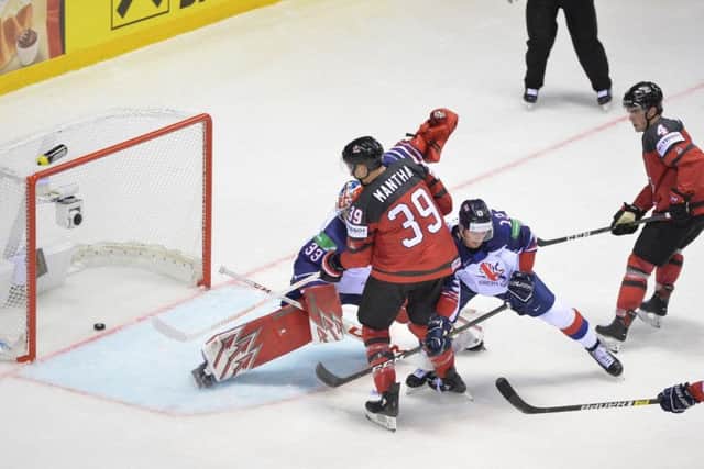 Canada's Anthony Mantha scores past Ben Bowns in Kosice. Picture: Dean Woolley.