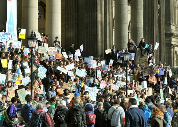 Striking school children in Leeds to highlight their concerns over climate change.