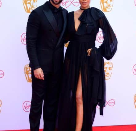 BOTH IN EVENING BLACK: 
Marvin Humes and Rochelle Humes attending the Virgin Media BAFTA TV awards, held at the Royal Festival Hall in London. Ian West/PA Wire