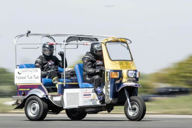 Matt Everard drives his tuk tuk during a world speed record attempt at Elvington Airfield. PIC: Danny Lawson/ PA Wire