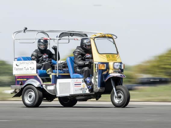 Matt Everard drives his tuk tuk during a world speed record attempt at Elvington Airfield. PIC: Danny Lawson/ PA Wire
