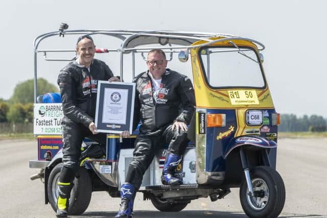 Matt Everard (right) and passenger Russell Shearman celebrate their Guinness World Record. PIC: Danny Lawson/ PA Wire