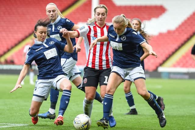Maddy Cusack of Sheffield Utd challenged by Millwall players during the The FA Women's Championship match at Bramall Lane, Sheffield. (Pictured: Harry Marshall/Sportimage)