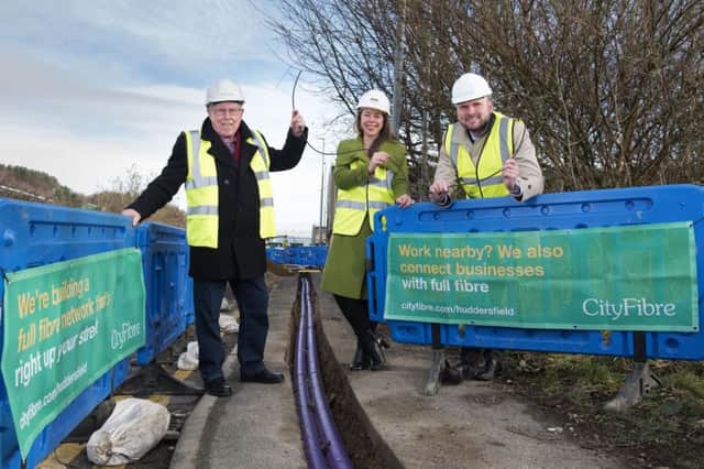 Councillor Peter McBride of Kirklees Council with Kim Johnston and Stephen Moore of CityFibre