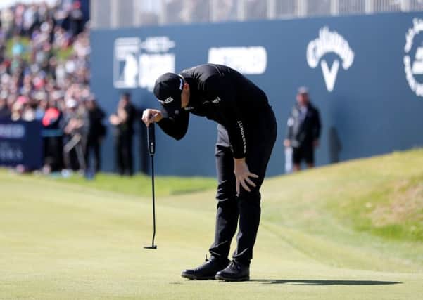 Matt Wallace reacts to missing his birdie put on 18th during day four of the Betfred British Masters at Hillside. Picture: Richard Sellers/PA