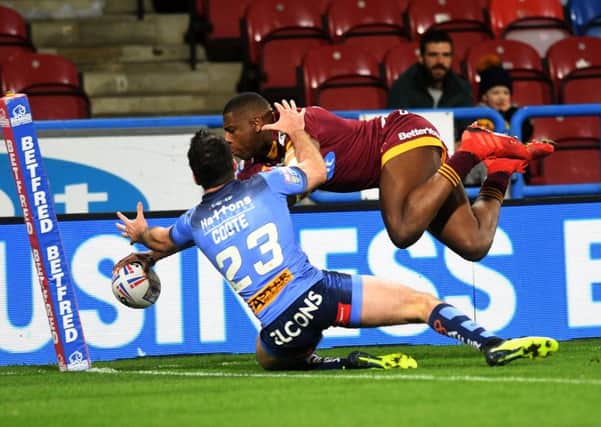 DANGER MAN: Huddersfield Giants' Jermaine McGillvary scores against St Helens in March this year. 
Picture: Jonathan Gawthorpe