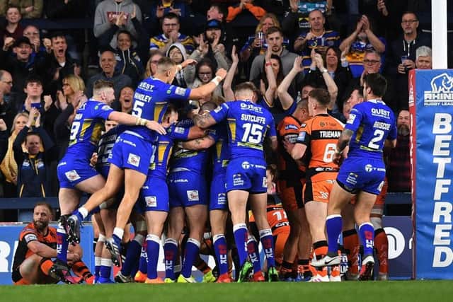Leeds Rhinos players mob Matt Parcell after his try, their only one of the game in defeat to Castleford Tigers (
Picture: Jonathan Gawthorpe).