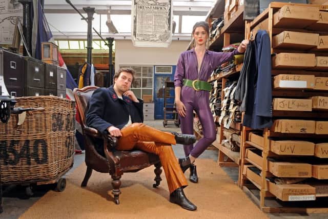 In the Sunny Bank Mills Archive which holds thousands of cloths, designs and wool dyeing recipe cards, weaving looms, ledgers, photos, memorabilia and books. Rose Muirhead wears 1970s purple jumpsuit from Nowhere Near New, £35; Chelsea boots from Rose & Brown Vintage, £10. Rupert Hughes wears 1960s navy jacket with anchor patches from Rose & Brown Vintage, £15; 1970s tan leather trousers from Rose & Brown Vintage, £10.


Picture Tony Johnson.