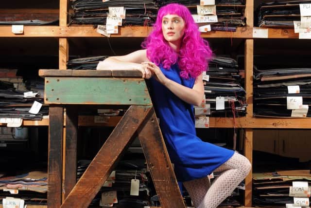 In the Sunny Bank Mills Archive which holds thousands of cloths, designs and wool dyeing recipe cards, weaving looms, ledgers, photos, memorabilia and books. Rose Muirhead wears 1960s blue chiffon dress, £40 and 1980s gold Bruno Magli shoes, both from Vintage Beau. Sunnybank Mills in Farsley, Leeds.  Picture Tony Johnson.