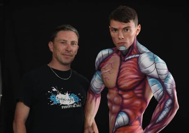 John Jones, left, with a body painted model. Pic: Terry George