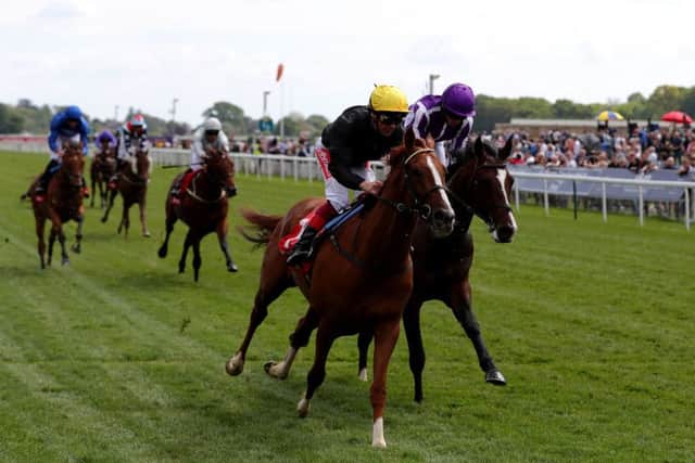 Stradivarius and Frankie Dettori pull clear of the Ryan Moore-ridden Southern France in the Yorkshire Cup.