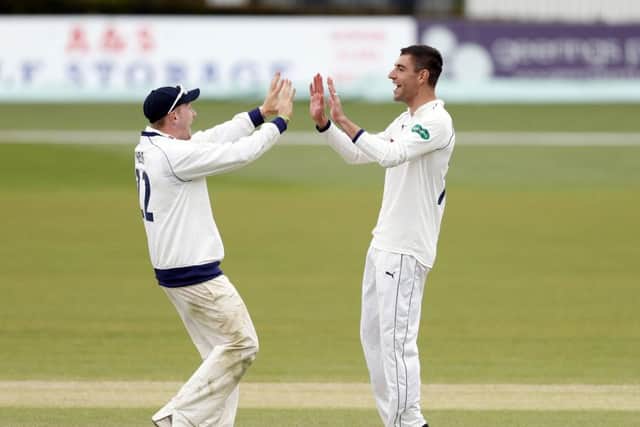 Duanne Olivier is congratulated by Dom Bess after he took the wicket of Fred Klaassen at Canterbury. Picture: Max Flego.
