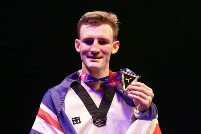 Great Britain's Bradly Sinden celebrates after winning the Men's -68kkg final against Spain's Javier Perez Polo at Manchester Arena. Picture: Martin Rickett/PA