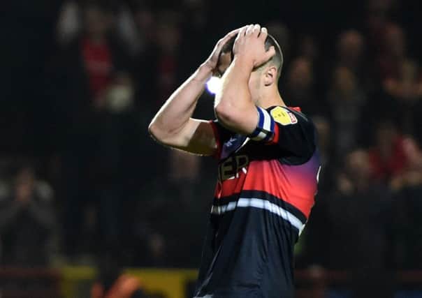Tommy Rowe is distraught after his decisive miss for Doncaster Rovers in the shoot-out (Picture: Harriet Lander/Getty Images).