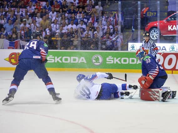 Jackson Whistle, far right, denies a goal for Slovakia in Saturday night's 7-1 defeat in Kosice. Picture: Dean Woolley.