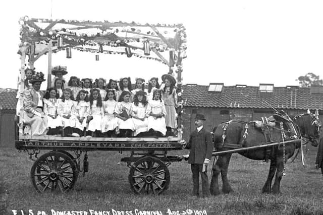 Children on a decorated wagon at Doncaster Infirmary carnival in 1909.