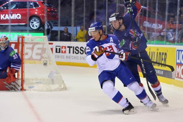 Davey Phillips battles for possession during Saturday night's 7-1 defeat to hosts Slovakia. Picture: Dean Woolley