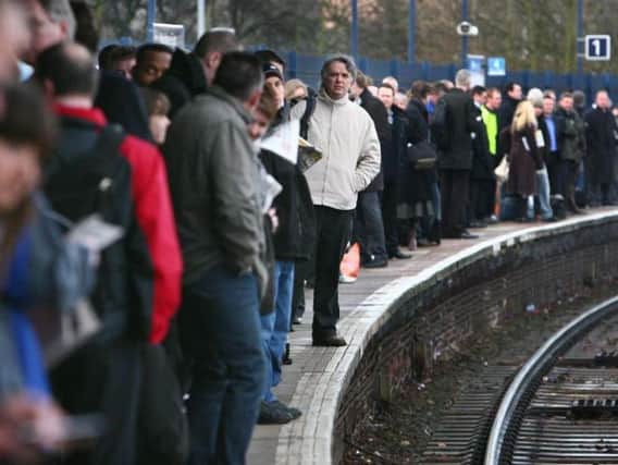 Commuters on a platform. Credit:Gareth Fuller/PA
