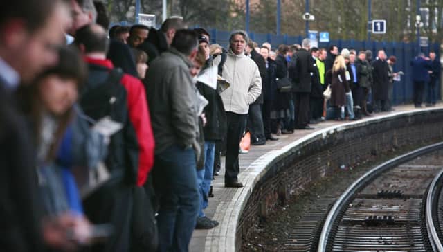Commuters waiting on the platform.