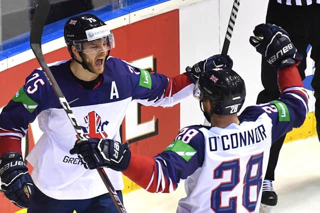 Robert Dowd and Ben O'Connor celebrate the start of GB's comeback after the Sheffield Steelers forward made it 3-1 in the 34th minute. Picture: Getty Images.