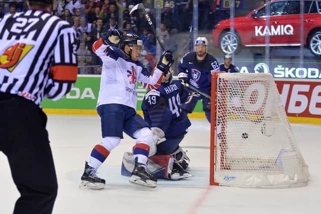 MAGIC MOMENT: Ben Davies wheels away to celebrate his game-winning overtime goal to send France down to Division 1A and see Great Britain remain in the top tier. Picture: Dean Woolley.