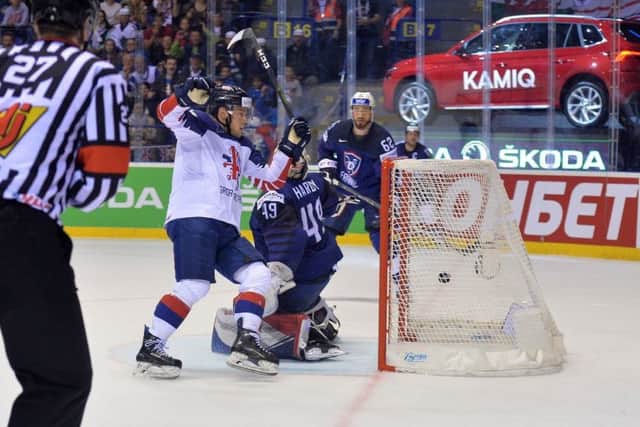 Ben Davies wheels away to start his celebrations after scoring the overtime winner for Great Britain against France in Kosice. Picture: Dean Woolley.