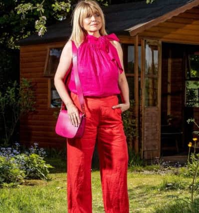 Christine Talbot wears wide leg red linen trousers, £59, and halterneck top, £55, both by John Lewis & Partners. Picture by Charlotte Graham.