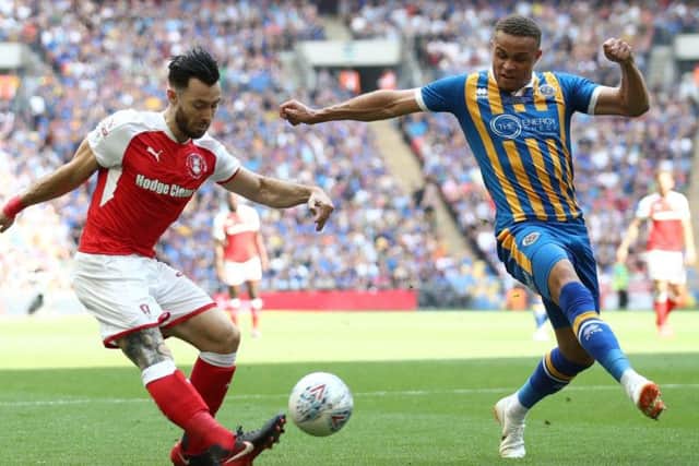 Carlton Morris (right) in action for Shrewsbury Town against Rotherham United in the League One play-off final in May 2018. It was his last competitive appearance due to a serious knee injury.