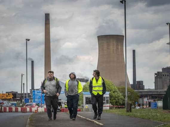 Workers leave the steelworks plant in Scunthorpe as British Steel goes into liquidation
