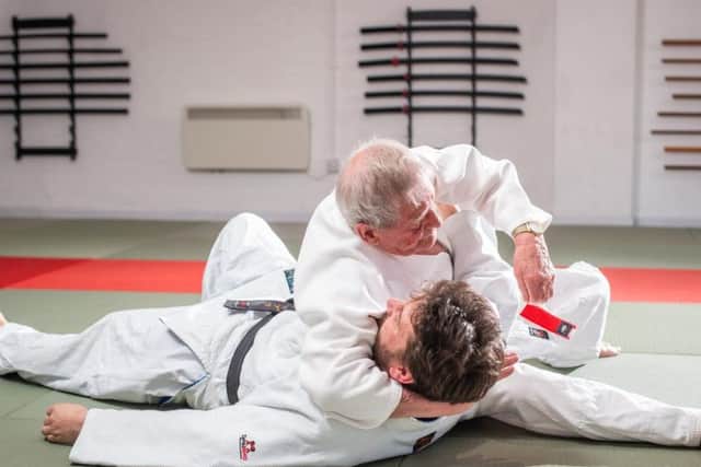 Bill is seen performing judo moves against an opponent. PIC: SWNS