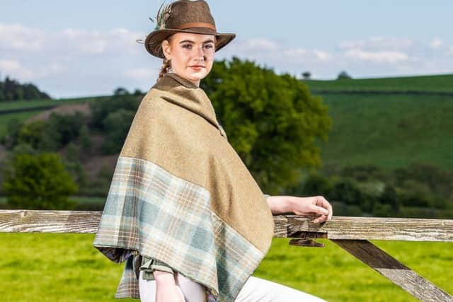 Two tone fine tweed cape in tawny brown/teal with blue and gold paisley lining and brass popper fastenings £125. Clothes by Galijah. Charlotte Graham

Pictures