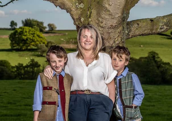 Sarina Dean with Elijah Dean aged 7 and Gabriel Dean aged 10 both wearing bespoke Galijah gilets available on request.  Clothes by Galijah. Charlotte Graham

Pictures.