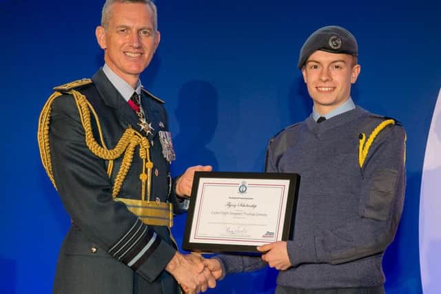 Thomas receiving his scholarship. PIC: RAF Press Office